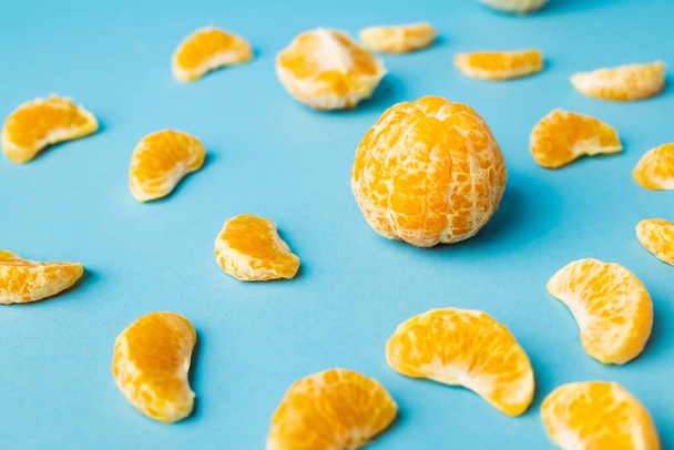 Close up view of peeled tangerines on blue background - Photo, Image