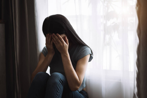 crying woman in Depression covering face at home in room  - Fotó, kép