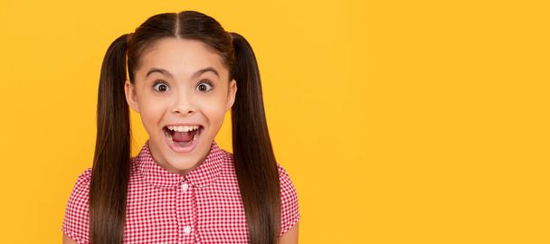 What a pleasant surprise. Girl keep mouth open with surprise. Surprised kid yellow background. Child face, horizontal poster, teenager girl isolated portrait, banner with copy space - Fotó, kép