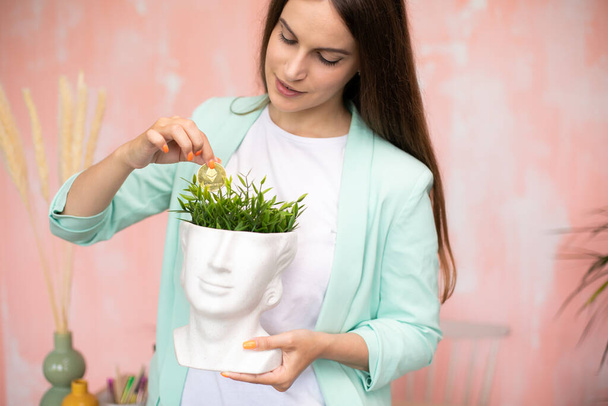 Girl finding cryptocurrency in head with grass. High quality photo - Foto, imagen