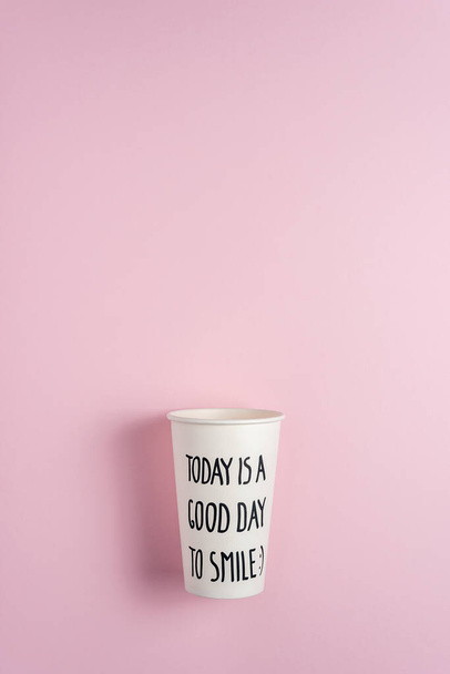 White paper cup on pink background. Creative minimal drink concept. - Foto, Imagem