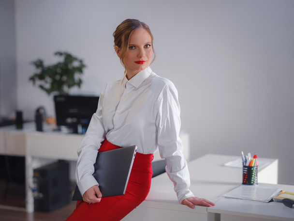 Business woman working in office. Online business, young professional in workplace. Portrait of attractive cheerful lady hr leader director real estate agency broker at work place station indoors - Photo, Image
