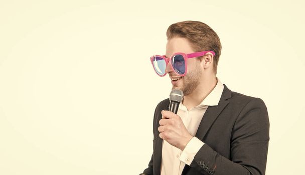 Master of ceremony. Emcee isolated on white. Emcee or conferencier in funny glasses. Speaker speak to microphone. Dedicated to speaking out, copy space. - Fotoğraf, Görsel