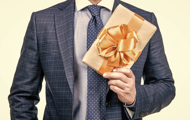 this is for you. occasion greeting. businessman showing gift box. corporate present. womens day. successful ceo holding giftbox. cropped man prepare for romance date. man with business reward. - Fotó, kép