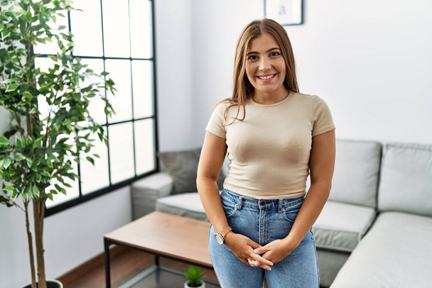 Young hispanic woman smiling confident at home - Photo, Image