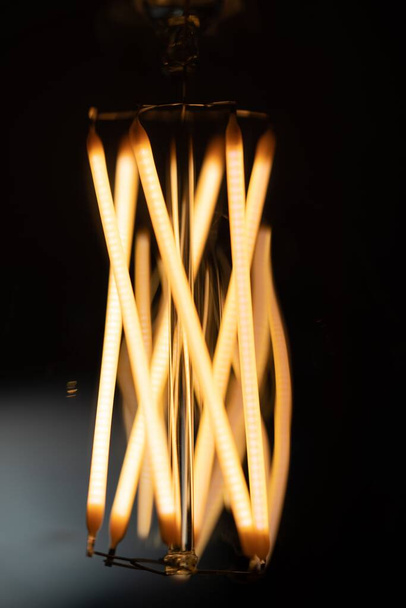 A vertical closeup shot of Incandescent light bulbs - Foto, afbeelding