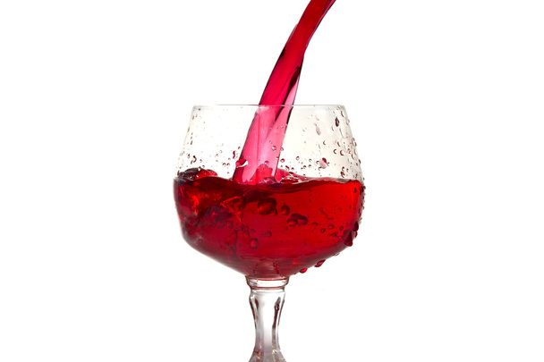 Red wine pouring into wine glass - Foto, Imagen