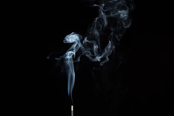 incense stick with smoke against black background - Fotografie, Obrázek