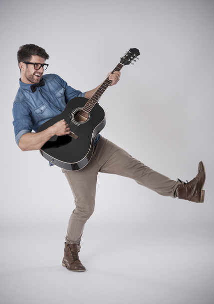 Fashion musician with guitar - Photo, Image