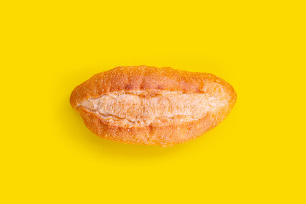 Bread isolated on yellow background - Fotografie, Obrázek