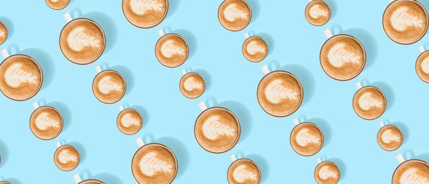 Many cups of coffee on light blue background. Pattern for design - Foto, Imagen