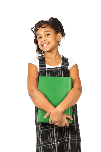 smart girl with big green book is standing on a white background - Фото, изображение
