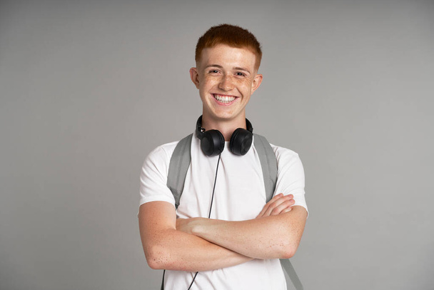 Portrait of smiling ginger male student  - Foto, afbeelding