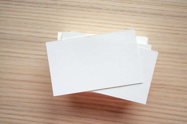 White business card on wood table background - Fotografie, Obrázek