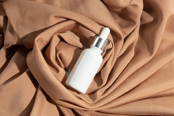mockup tube bottle for skin care cosmetic, product branding, serum dropper cream lotion treatment with natural flower - Valokuva, kuva