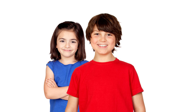 Childhood, fashion and people concept - happy smiling boy and girl looking at camera isolated on a white background - Fotó, kép
