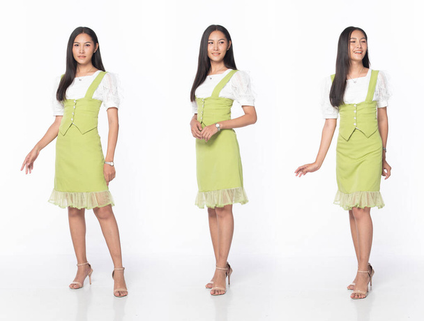 Full length body of Asian beautiful woman wear green office manager skirt dress, Teacher Business female stand express feeling happy smile over white background isolated - Photo, image