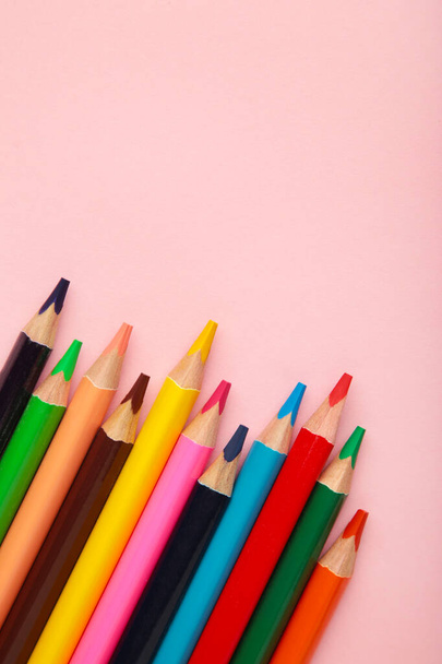 Color pencils on pink background. Top view. - Fotografie, Obrázek