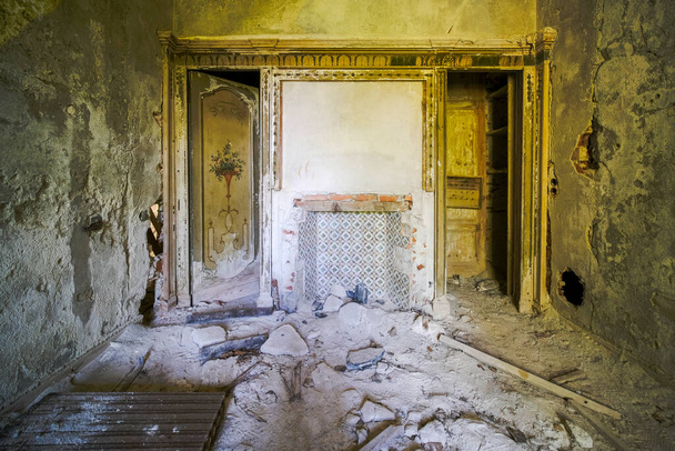 tired with wreckage and collapsed roof in abandoned house. High quality photo - 写真・画像
