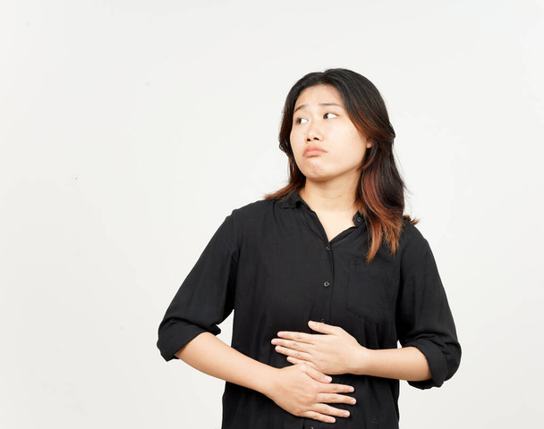 geste mal à l'estomac penser à la nourriture, concept affamé de belle femme asiatique isolé sur blanc - Photo, image