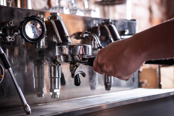 Close up of barista warming up espresso coffee machine. - Foto, Imagem