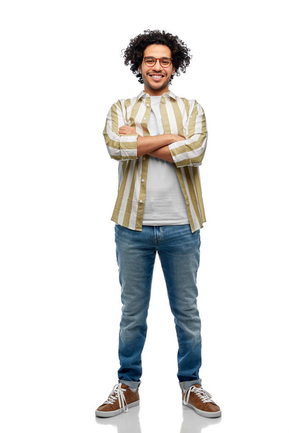 people and fashion concept - happy smiling man in glasses with crossed arms over white background - Photo, image