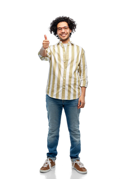 people and fashion concept - happy smiling man in glasses showing thumbs up over white background - Photo, Image