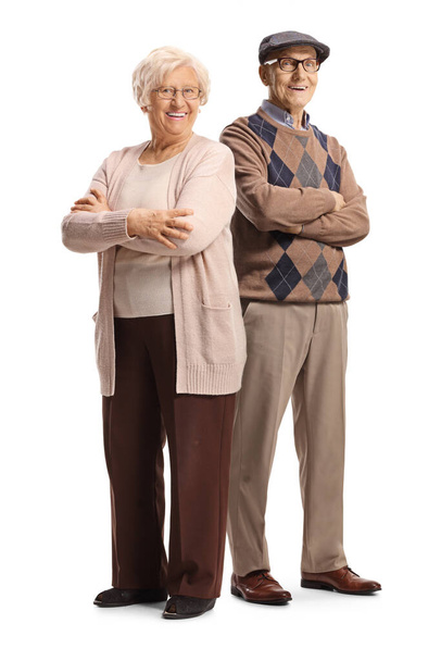Full length portrait of an elderly man and woman smiling and posing with crossed arms isolated on white background - Zdjęcie, obraz