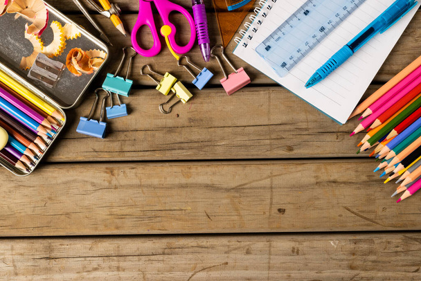 Composition of diverse school tools on wooden surface. School equipment, tools, learning and education concept. - Valokuva, kuva