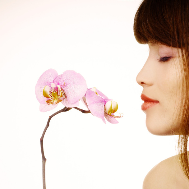 Mujer y orquídea
 - Foto, Imagen