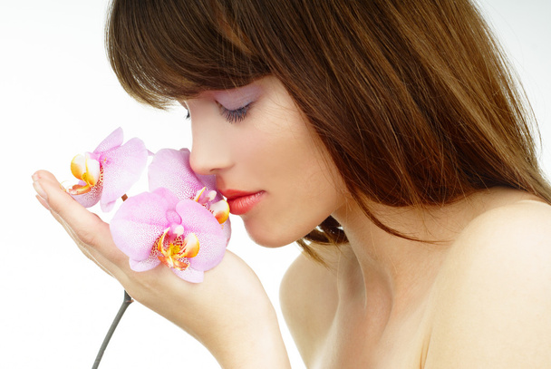 vrouw en orchid - Foto, afbeelding