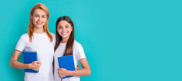 Mother and daughter child banner, copy space, isolated background. mom and teen girl study. private teacher and child holding workbooks. family help - Foto, Imagen
