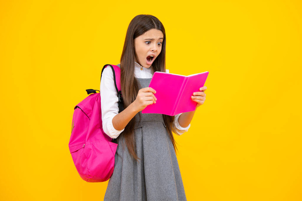 school teenage girl with book and copybook. Teenager schoolgirl student, isolated background. Learning and knowledge. Go study. Education concept. Surprised emotions of angry teenager girl - Фото, зображення