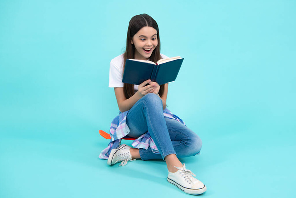 Teenager school girl study with books. Learning knowledge and kids education concept. Happy teenager, positive and smiling emotions of teen schoolgirl - Fotografie, Obrázek