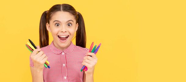 amazed teen girl hold colorful markers office supplies for painting, creative mind. Portrait of schoolgirl student, studio banner header. School child face, copyspace - Fotó, kép