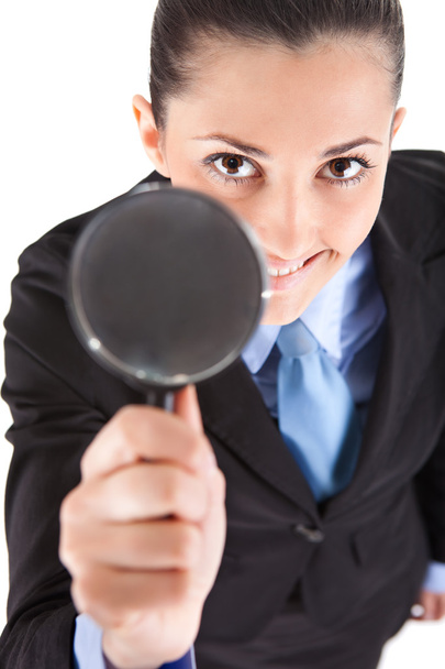 Businesswoman holding magnifying glass - Foto, Bild