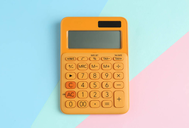 Modern calculator on color background, top view - Foto, Imagen