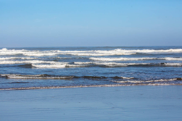 Breakers coming down on an Oregon beach in August, horizontal - 写真・画像