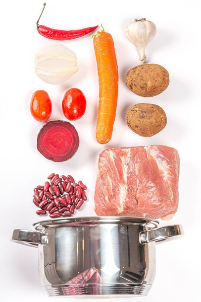 Metal pot and ingredients for cooking borscht - Valokuva, kuva