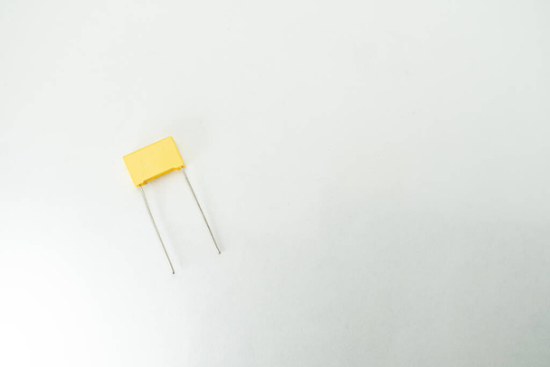 Isolated capacitor, used in electronic device. Electronic parts concept. - Foto, afbeelding