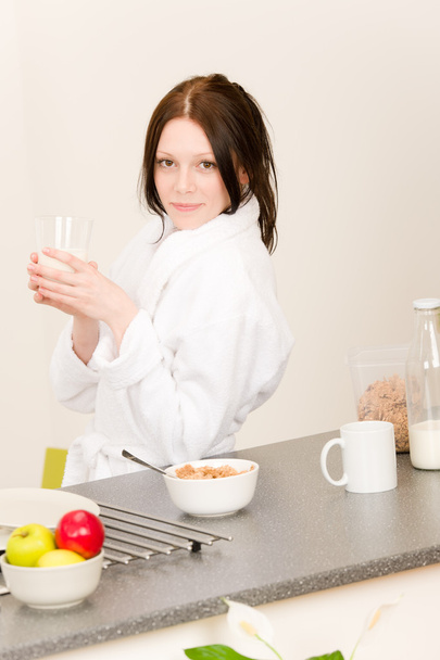 Young student girl have breakfast in kitchen - Valokuva, kuva