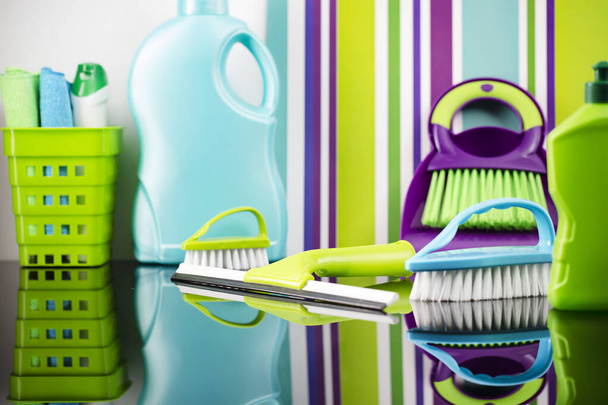 House  and office cleaning products. Colorful cleaning kit on striped color background. - Foto, imagen