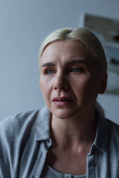 portrait of upset blonde woman with menopause looking away - Valokuva, kuva