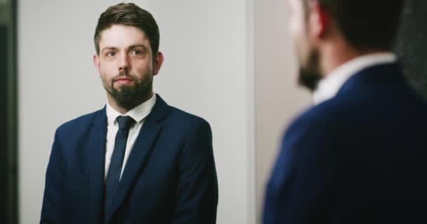 Nervous businessman looking in the mirror getting ready for the work day. Corporate man with composure staring at himself in the mirror and mentally preparing for important formal business interview. - Filmmaterial, Video
