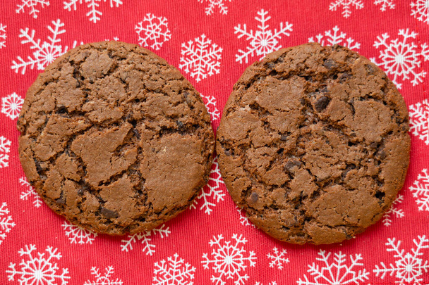 oatmeal cookies on red background with snowflakes, Christmas, healthy food - Photo, image