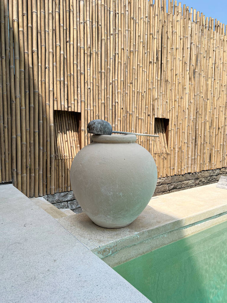 Beautiful clay pottery big water jar near a swimming pool design decoration for washing hand - Фото, зображення