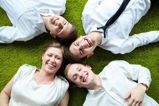 Top down shot of group of young business people having fun in an informal atmosphere. - Foto, Imagem