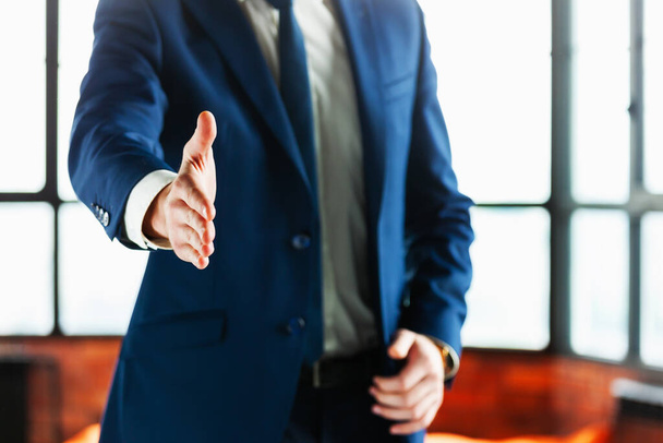 Cropped shot of business man with hand extended to handshake. - Foto, Imagem