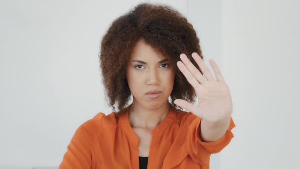 Female headshot serious angry sad frustrated african american girl biracial woman holding hand in front forbidden no stop enough gesture refusal keep distance sign refuse prohibits limitation palm - Séquence, vidéo