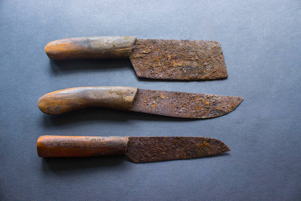 Rusty meat knife isolated on stone background - Zdjęcie, obraz